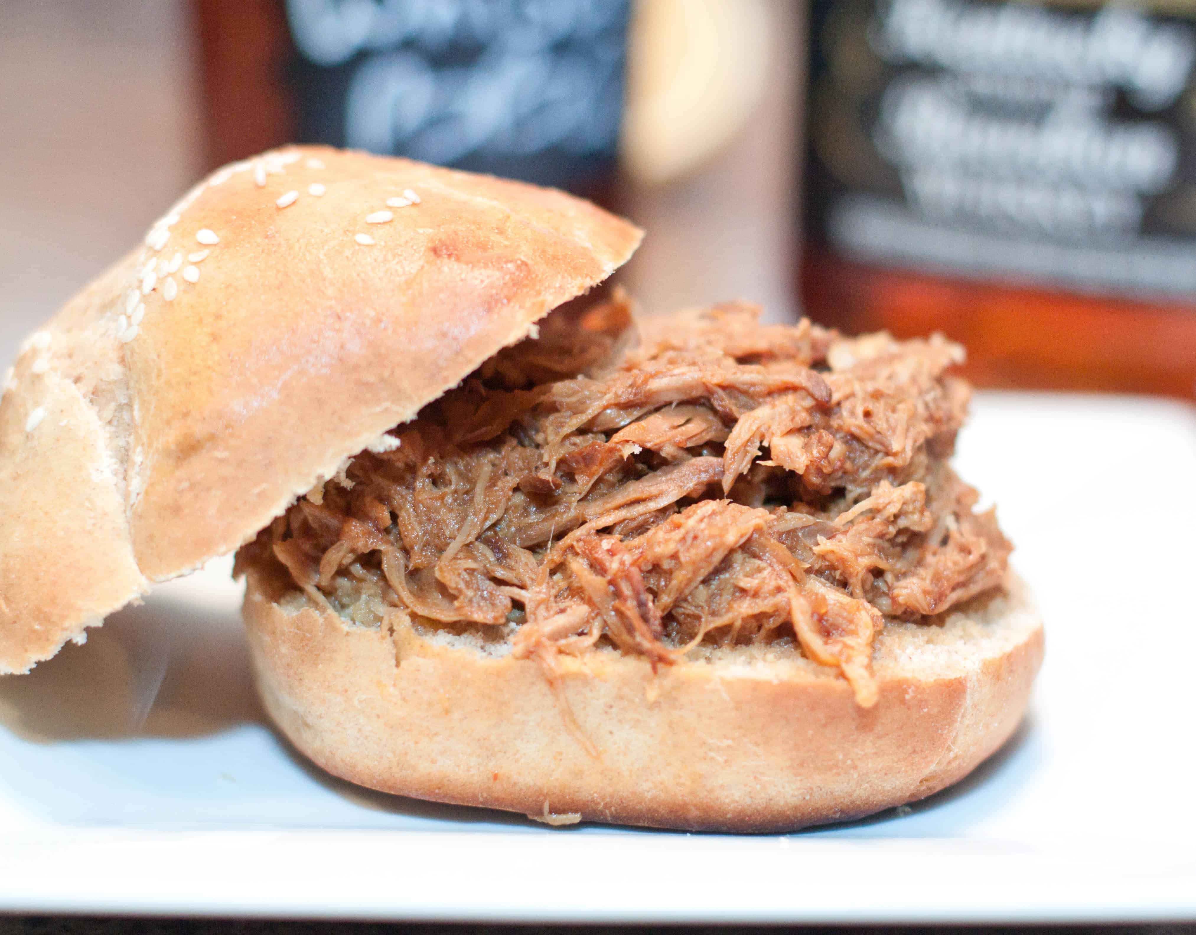 Slow Cooked From Scratch Pulled Pork Sandwiches! Homemade buns and a slow cooked pulled pork with a homemade whiskey BBQ sauce!