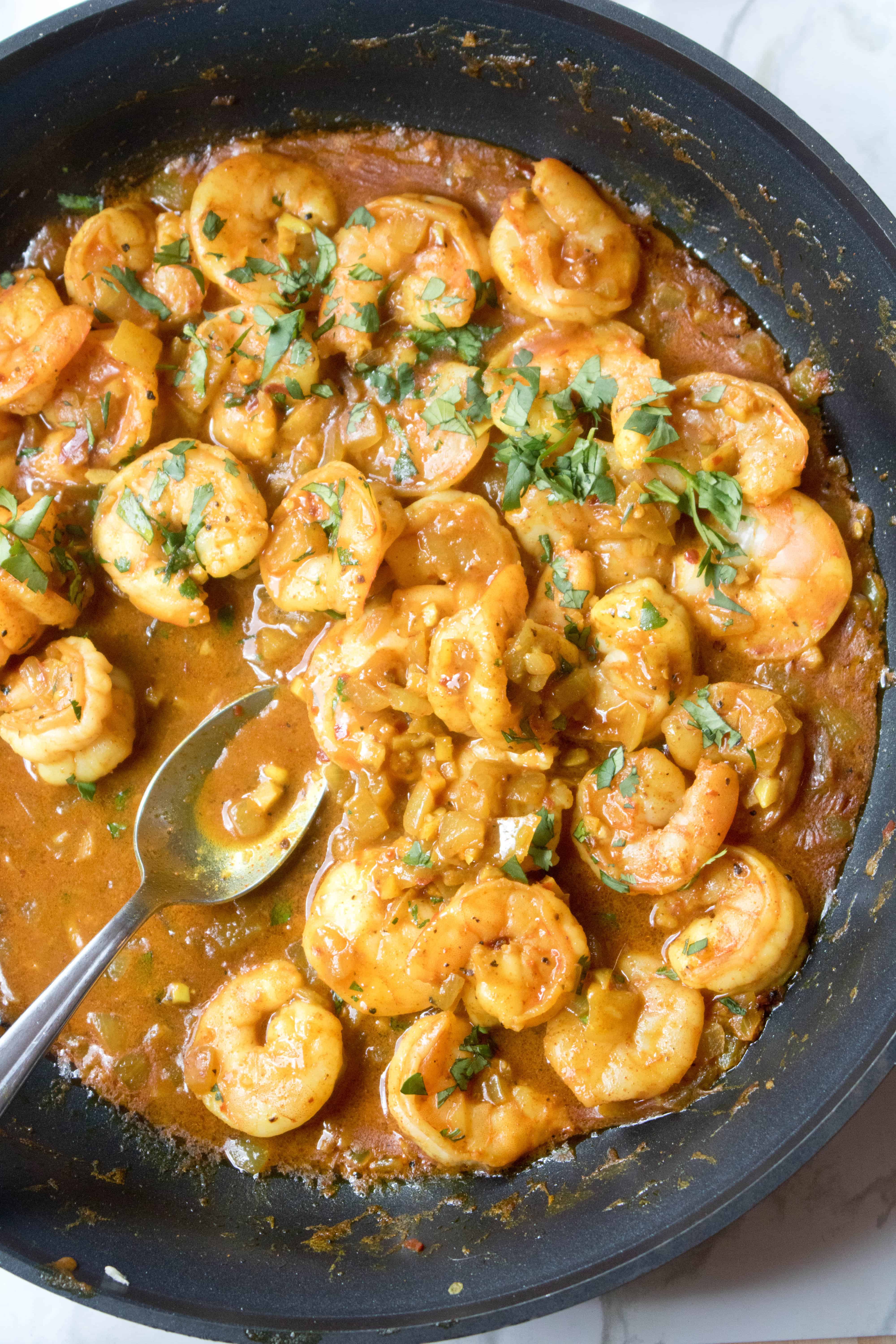 pan of curry shrimp.