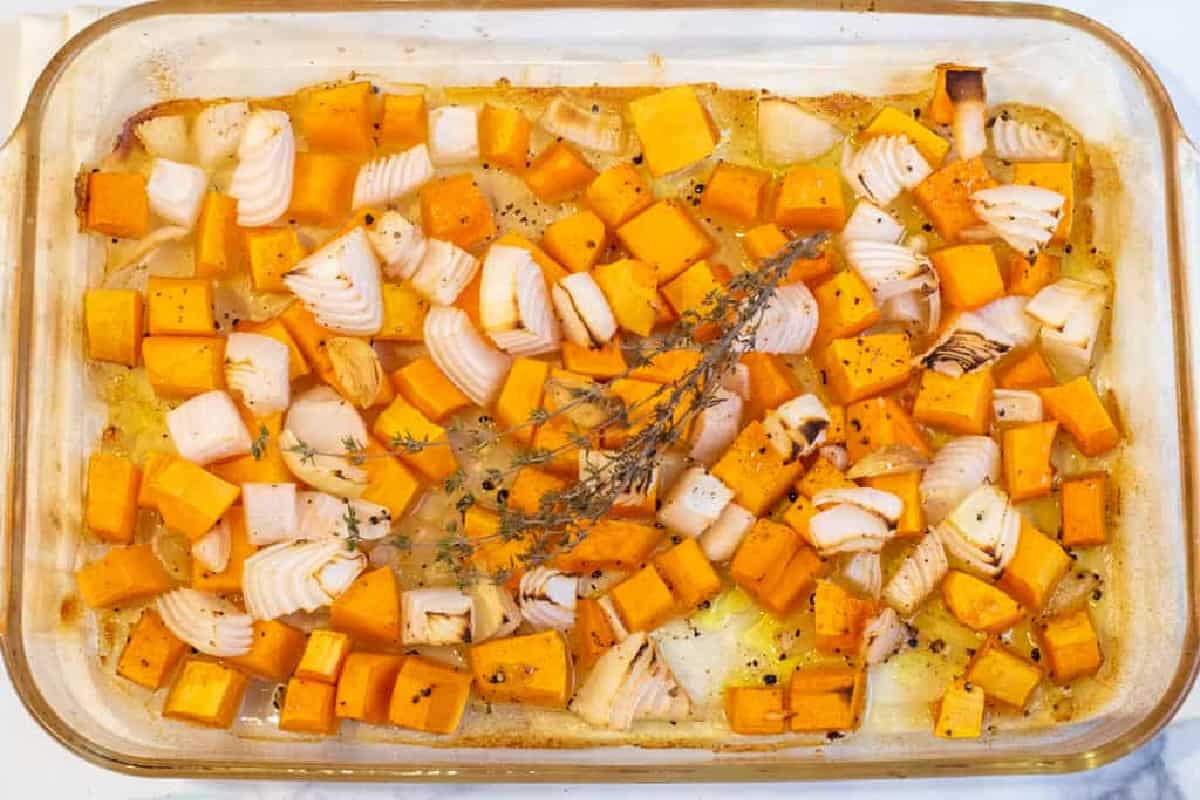 a pan of roasted butternut squash and onion with thyme.