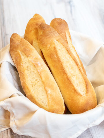 a bowl of fresh baked baguettes.