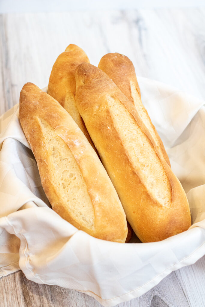 a bowl of fresh baked baguettes