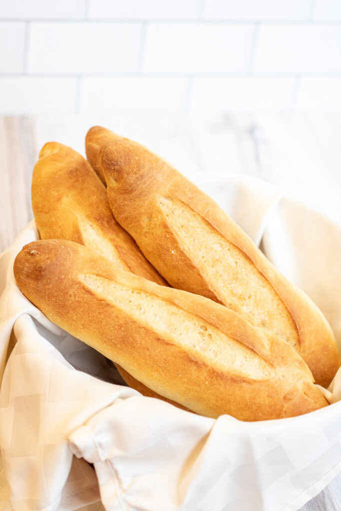 a bowl of fresh baked baguettes