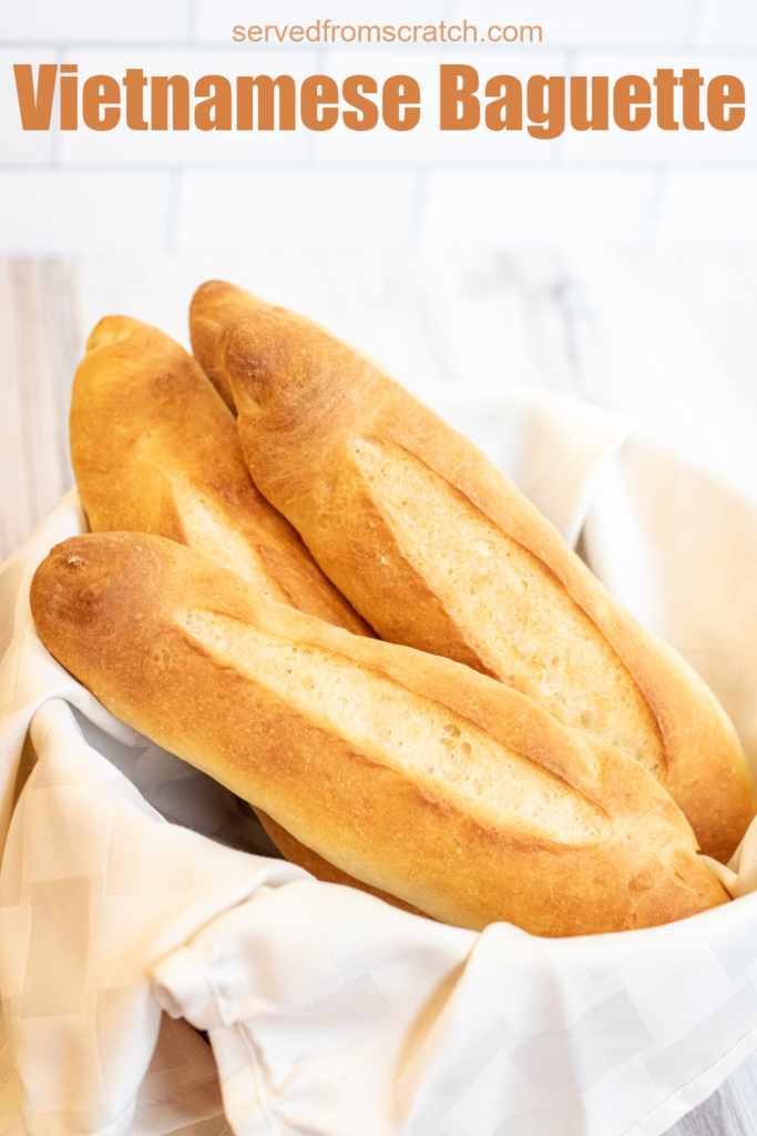 a bowl of fresh baked baguettes and pinterest text.