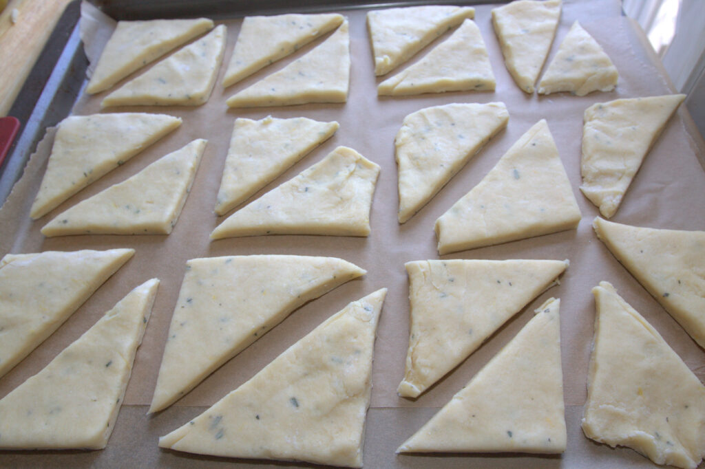 unbaked scones on parchment paper.