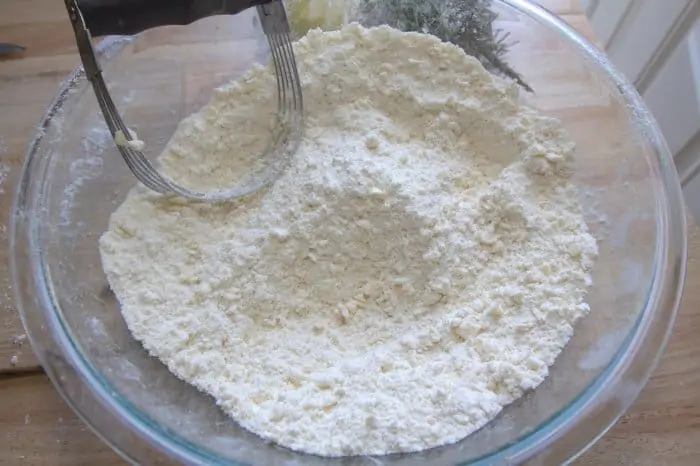 a bowl of cut flour and butter.