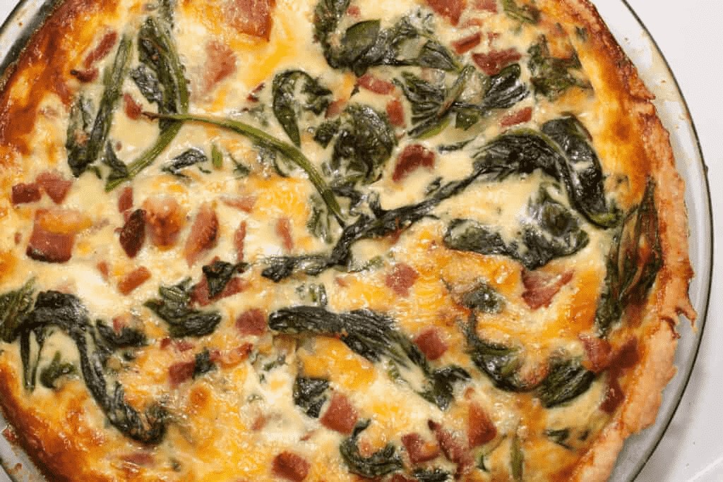 cooked spinach ham and cheddar quiche.