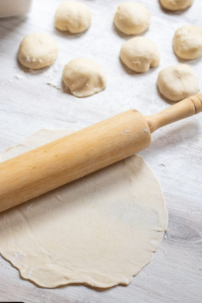 a rolling pin rolling out dough.