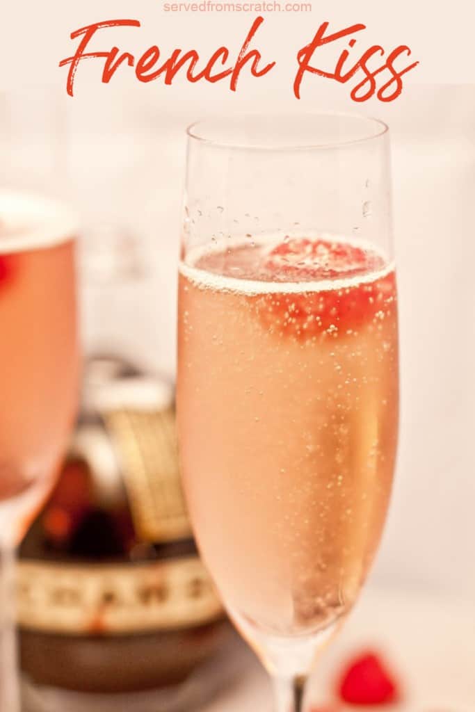 a glass of bubbly with raspberries with PInterest pin text.