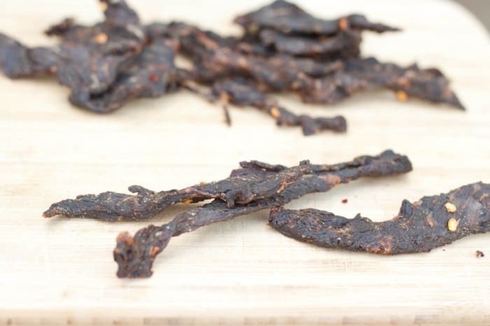 Beef Jerky on a cutting board.