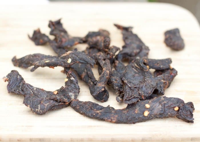 Beef Jerky on a cutting board.