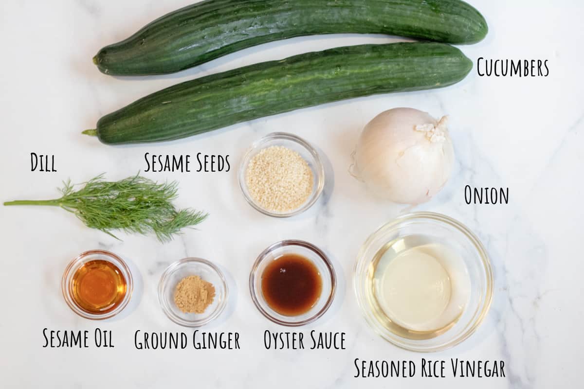 2 large cucumbers, dill, onion, sesame seeds, sesame oil, ground ginger, oyster sauce, and seasoned rice vinegar.