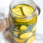 a large open jar of pickles.