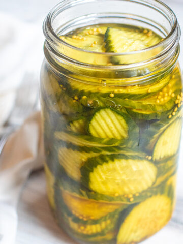 a large open jar of pickles.