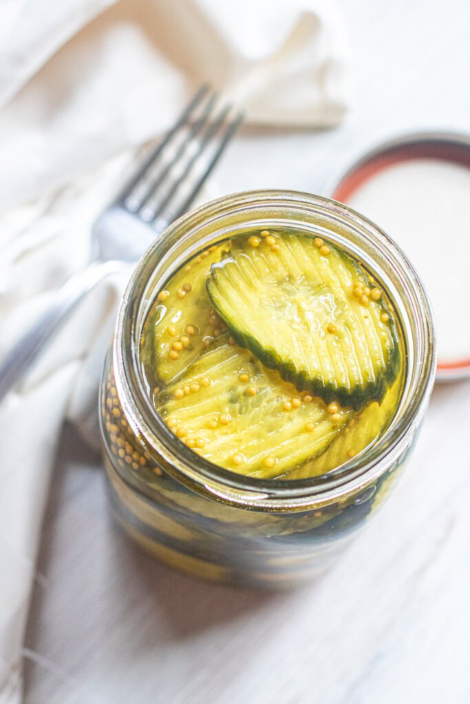 overhead of an open jar of pickles.