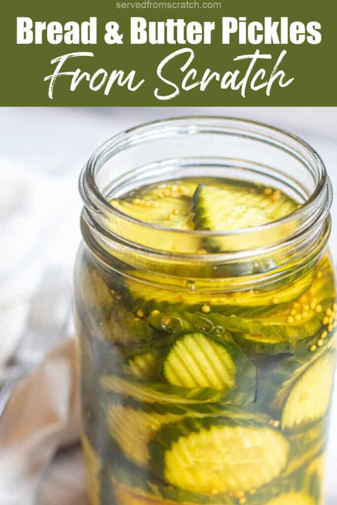 an open mason jar of bread and butter pickles with Pinterest pin text.