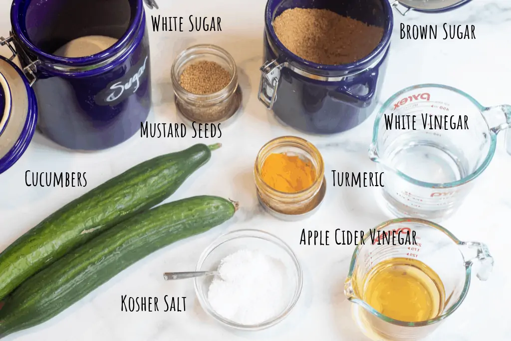 cucumbers, jars of sugar, spices, and pyrek with vinegars.