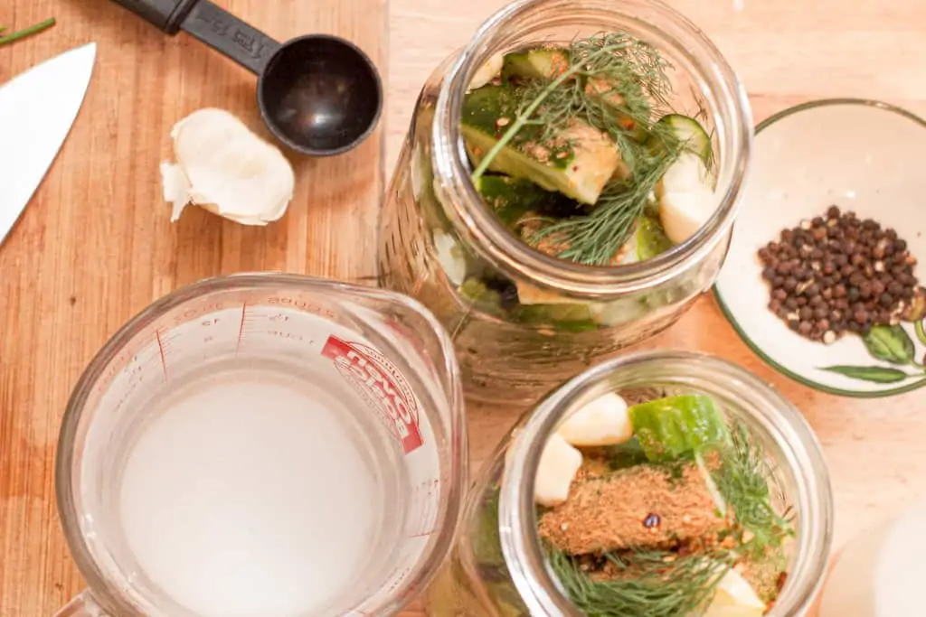 open jars of pickles and spices.