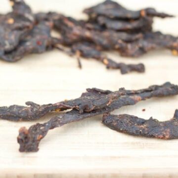 Beef Jerky on a cutting board.