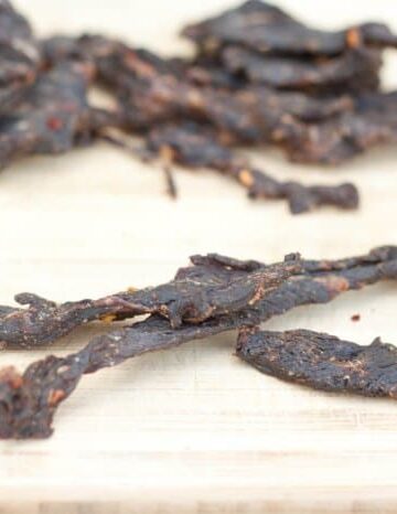 Beef Jerky on a cutting board.