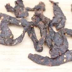 Beef Jerky on a cutting board.