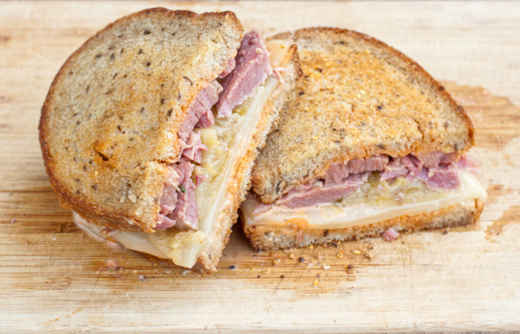 Rueben sandwich sliced in half 