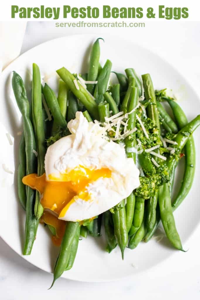 two plates with green beans and pesto and topped with a runny poached egg with Pinterest Pin.