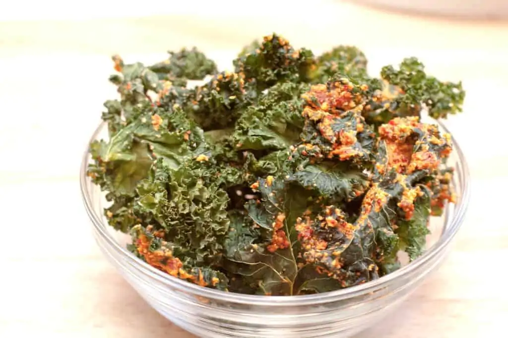 a bowl of chunky kale chips.