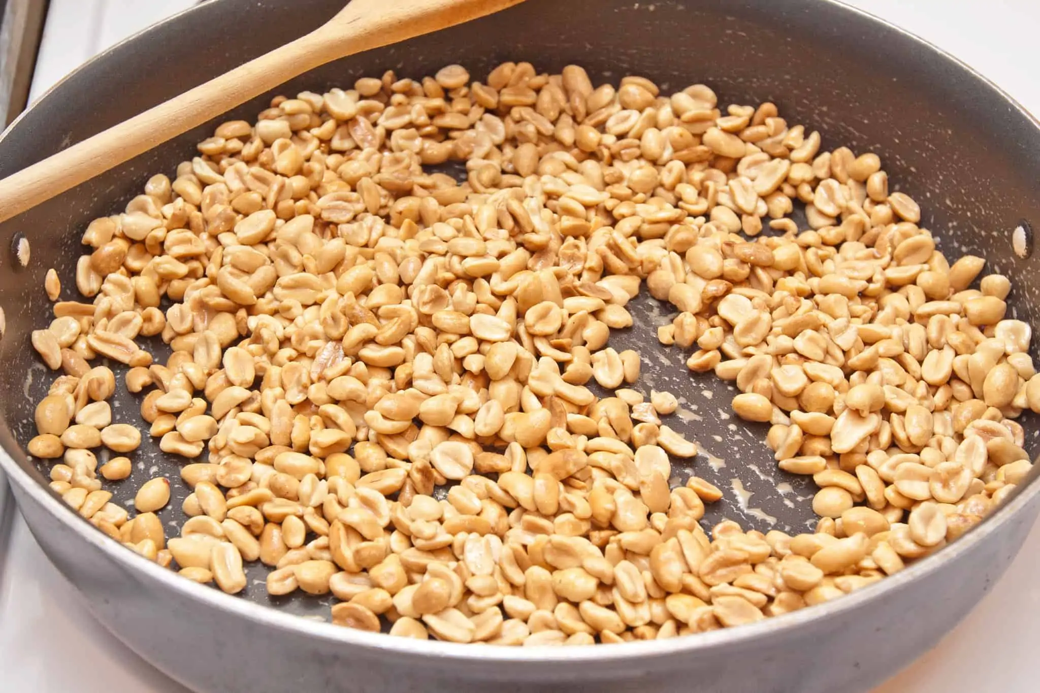peanuts roasting in a pan.