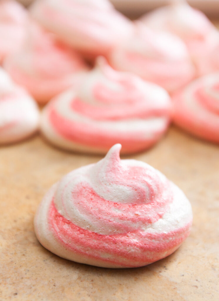 a pink striped meringue cookie 