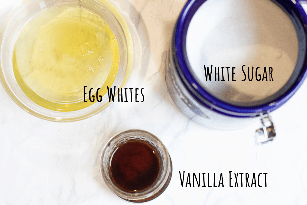 egg whites in a bowl, sugar, and vanilla extract