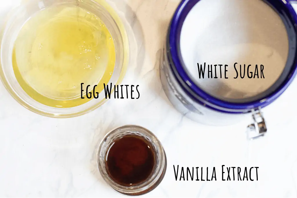 egg whites in a bowl, sugar, and vanilla extract 