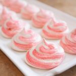 a pink striped meringue cookie