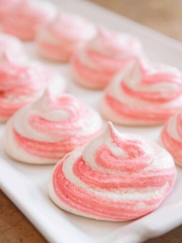 a pink striped meringue cookie