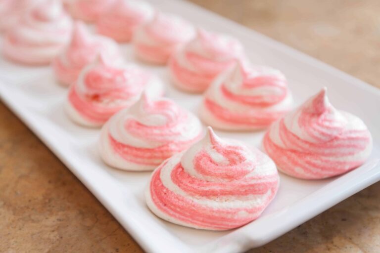 a pink striped meringue cookie