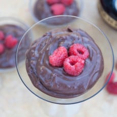 chocolate pudding with raspberries in a martini glass