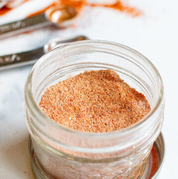 an open mason jar with taco seasoning.