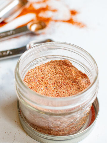 an open mason jar with taco seasoning.