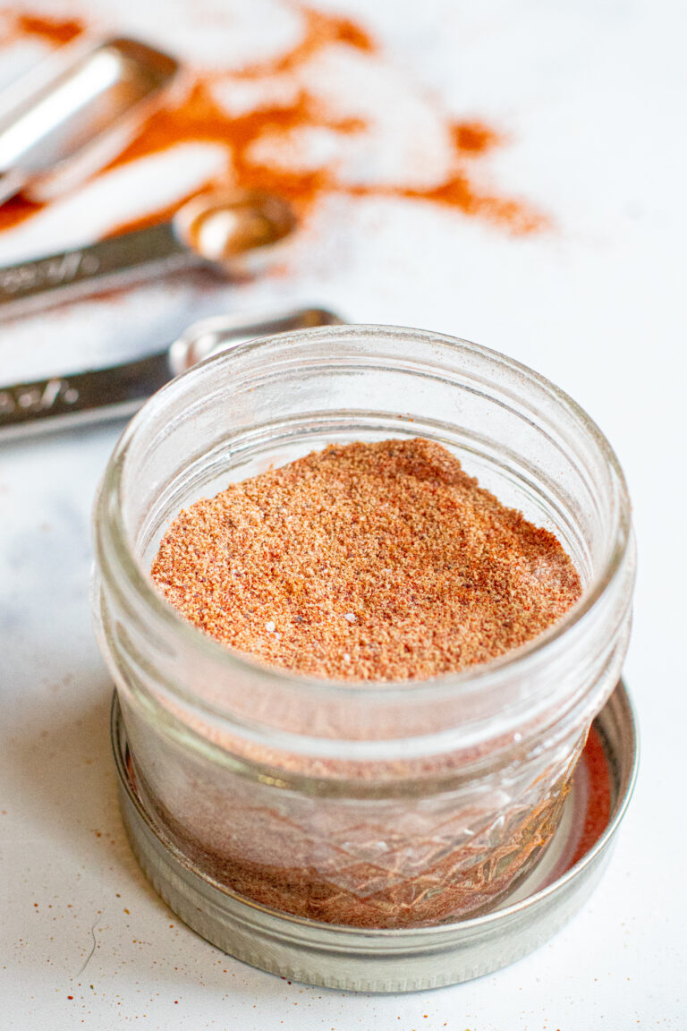 an open mason jar with taco seasoning.
