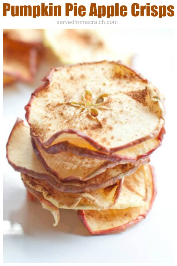stacked dried apple crisps with pumpkin pie spice with Pinterest pin text.