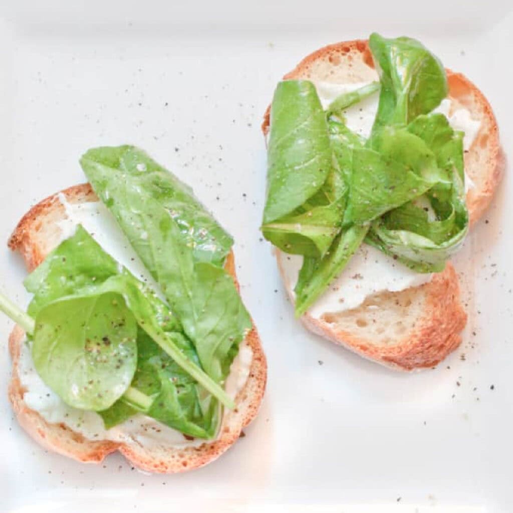 a place with arugula topped crostini.