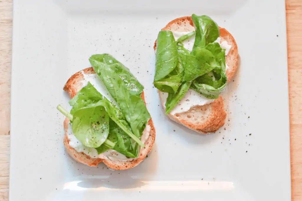 a place with arugula topped crostini.