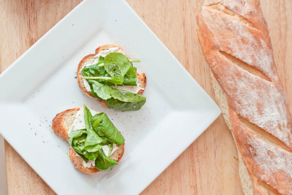 a place with arugula topped crostini.