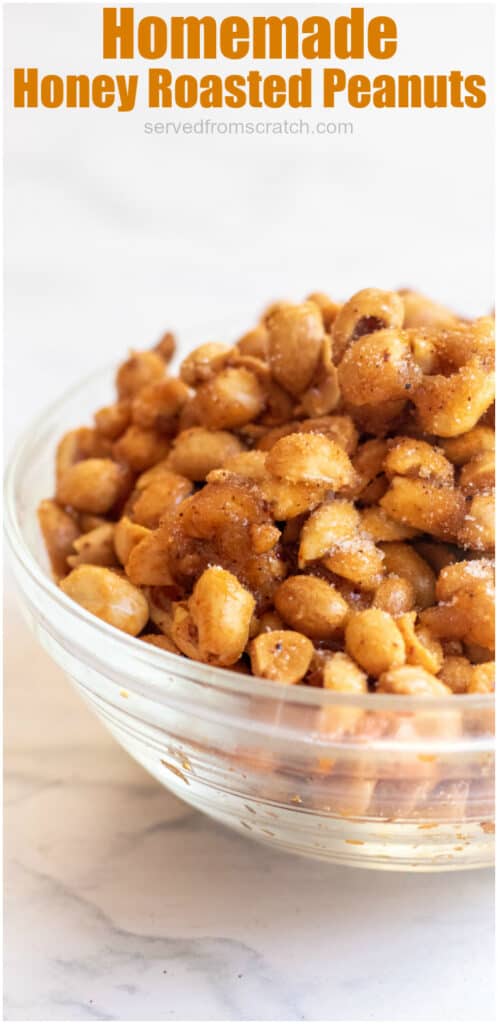 a bowl of honey roasted peanuts in a bowl with Pinterest pin text.
