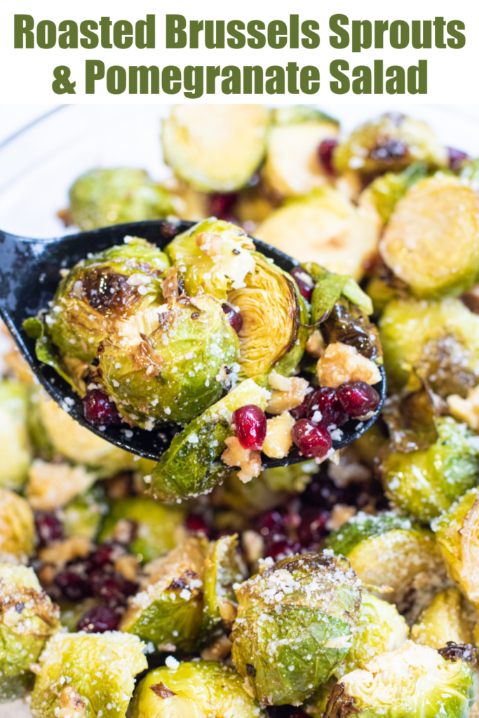 a spoon with roasted brussels, walnuts, and pomegranates with Pinterest pin text.