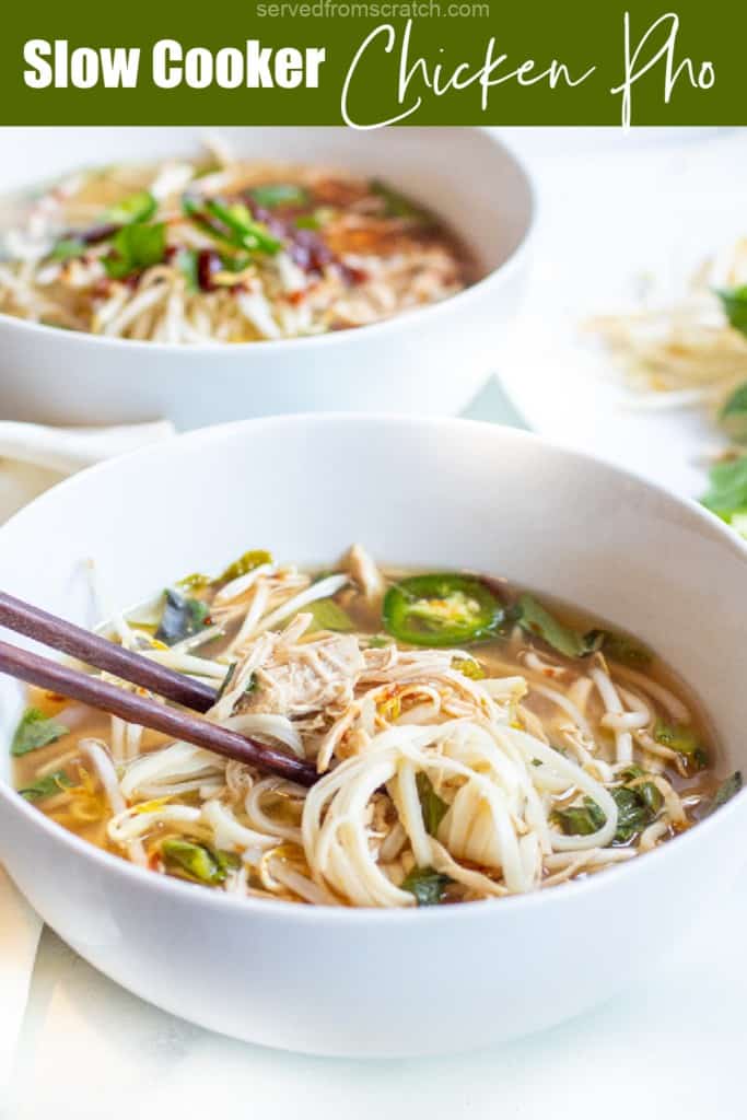 a bowl of pho with chopsticks and Pinterest pin text.