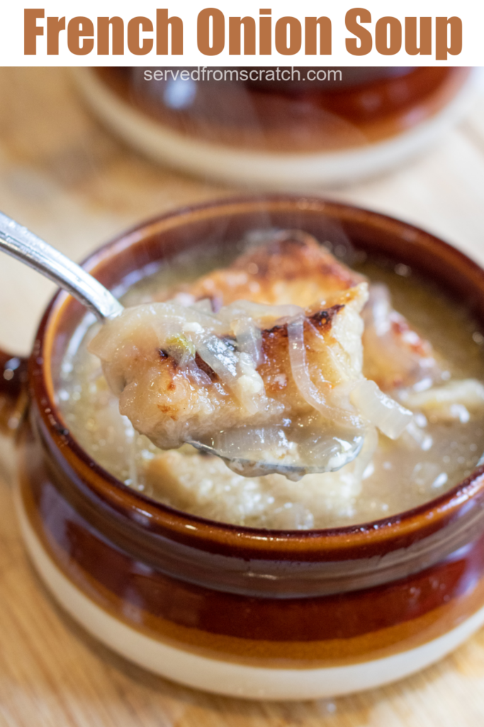 crock of soup with onions and bread with Pinterest pin text.