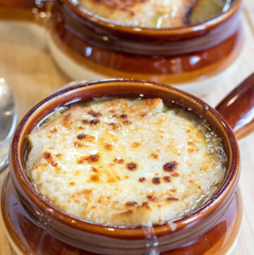 crocks of soup with melted cheese.