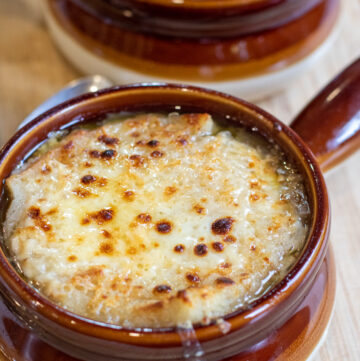 crocks of soup with melted cheese.