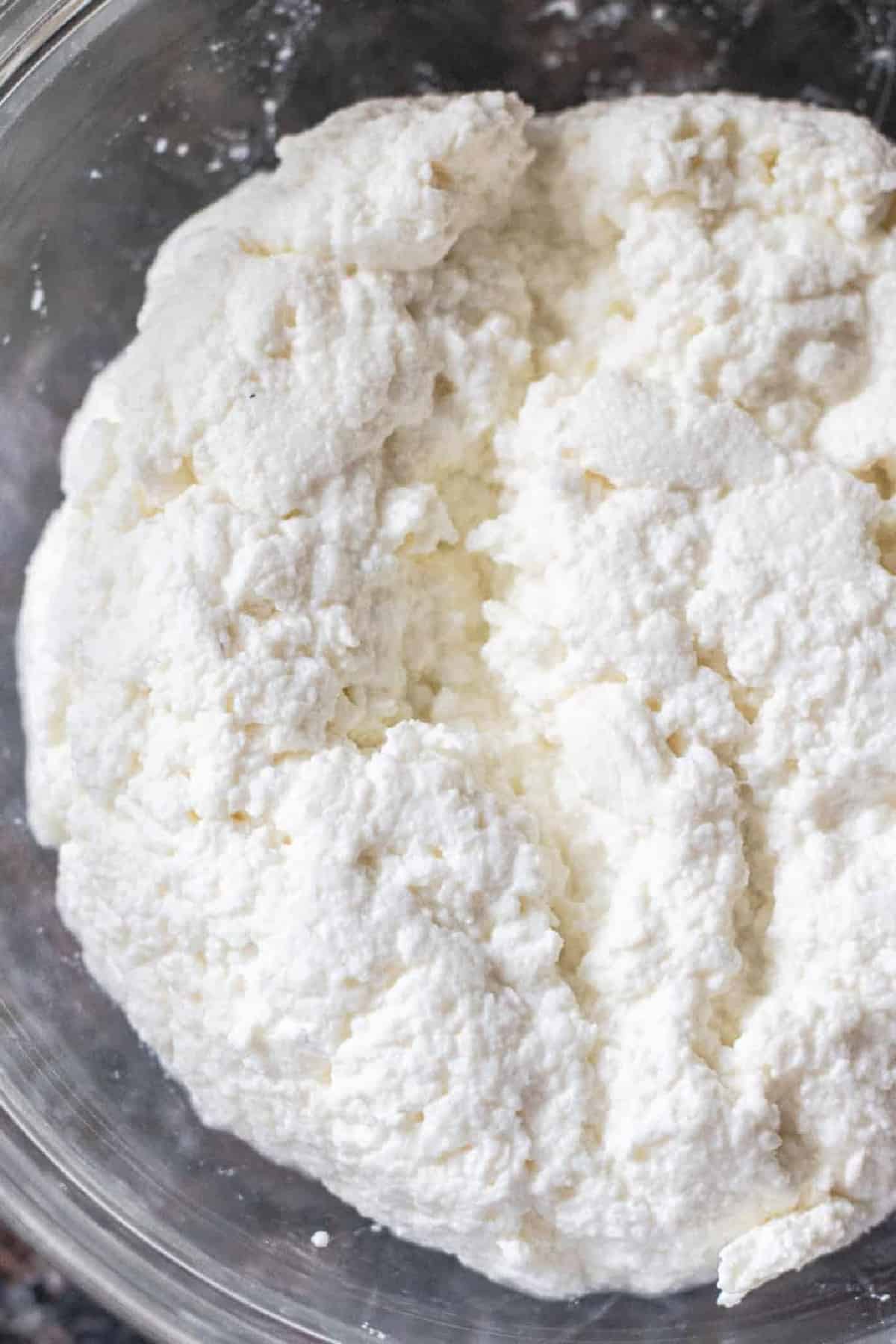 a bowl of fresh ricotta cheese.