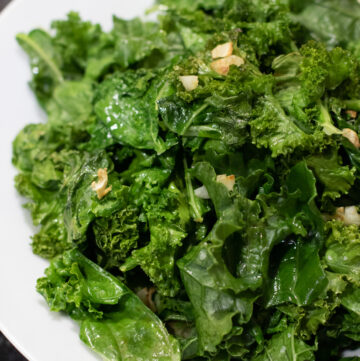 cooked garlic kale in a bowl.